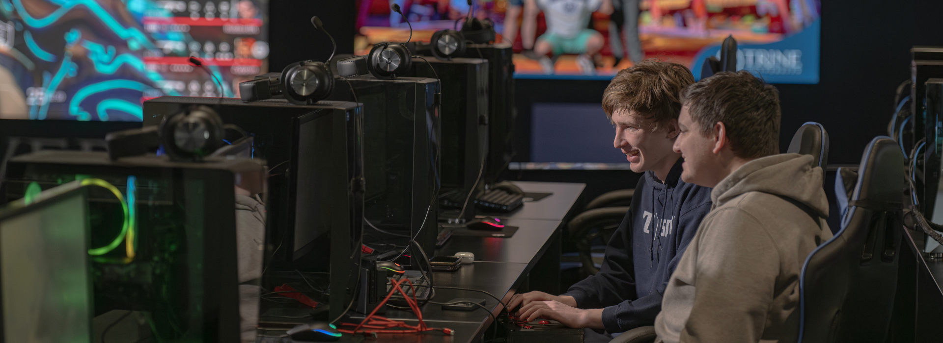 two students learning in trine university's esports arena