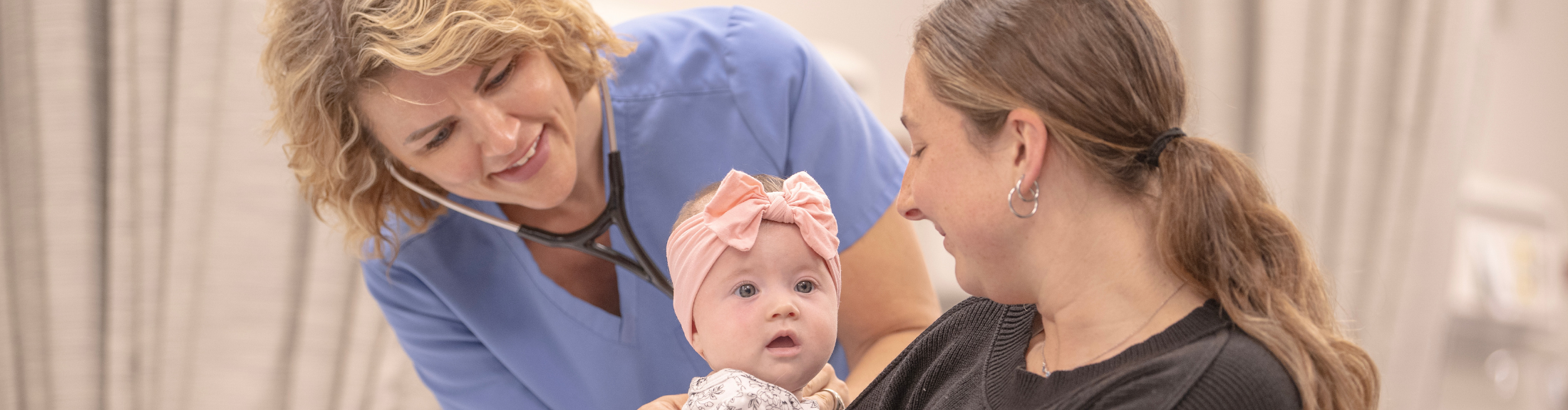 nurse providing care to a child and parent