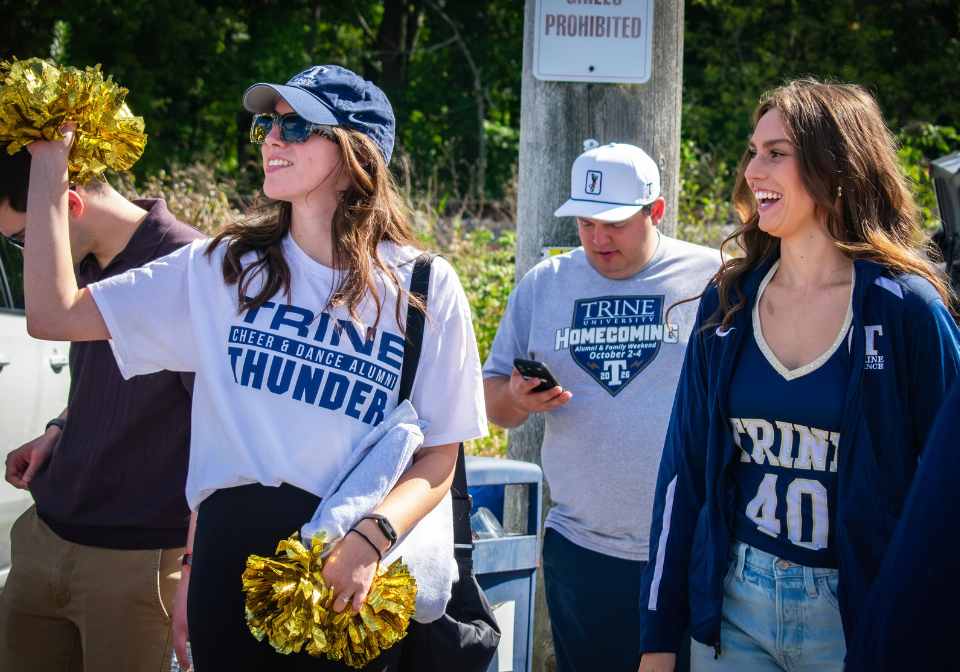 people in trine gear cheering