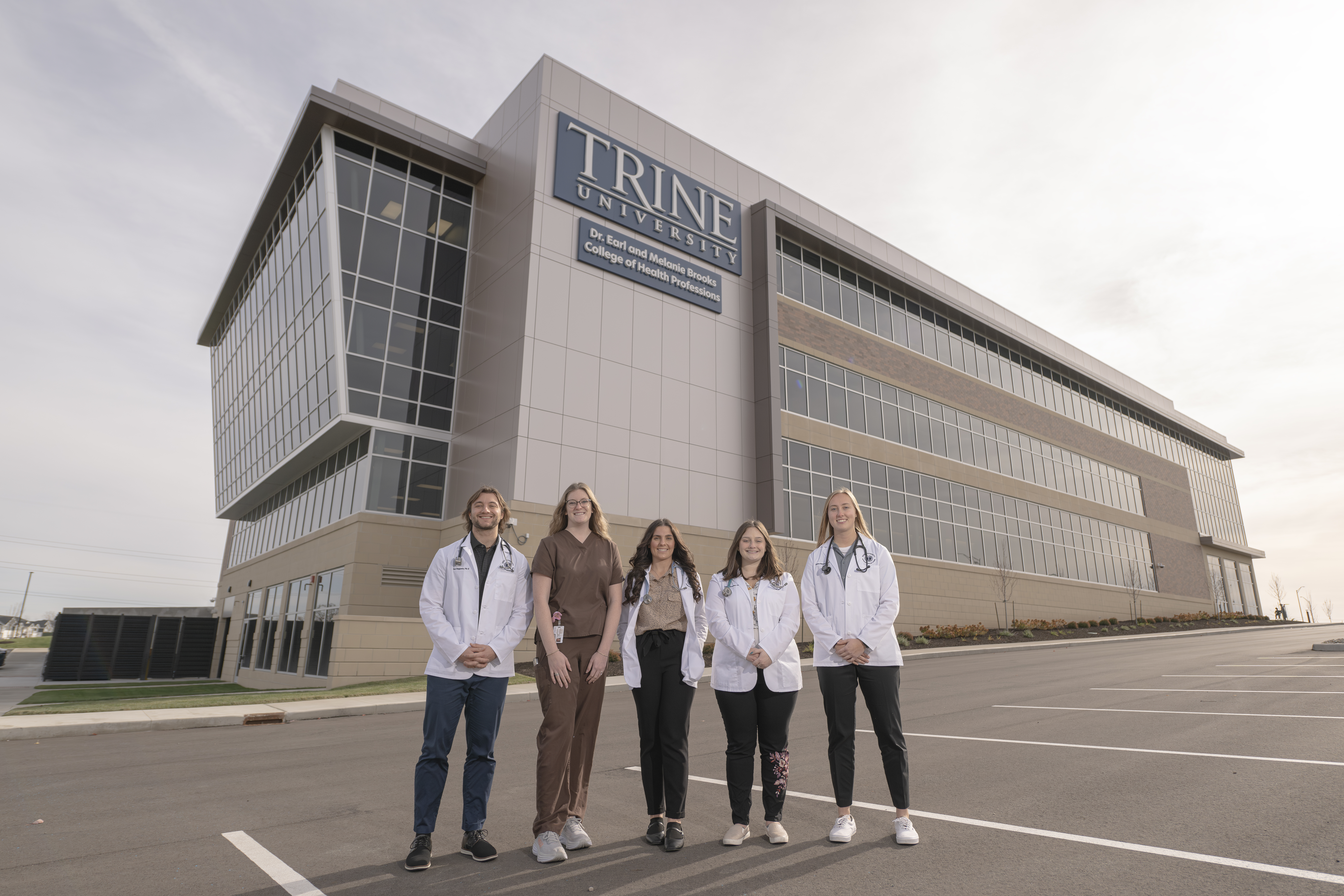 students standing in front of BCHP building