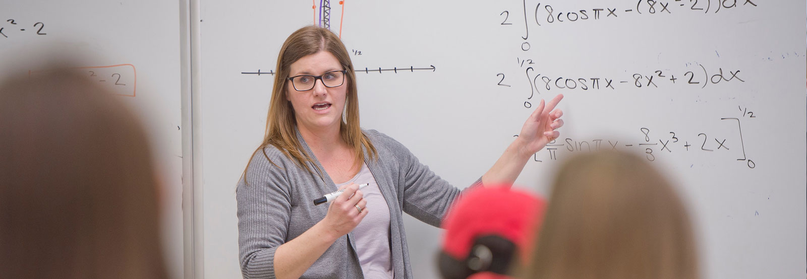 Professor showcasing statistics to students