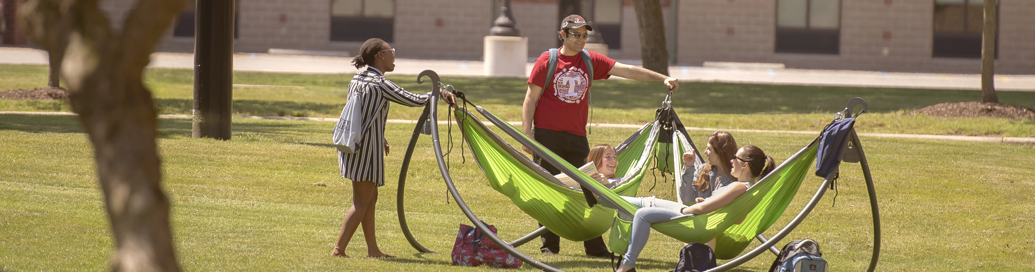 Students hanging out in a hammock