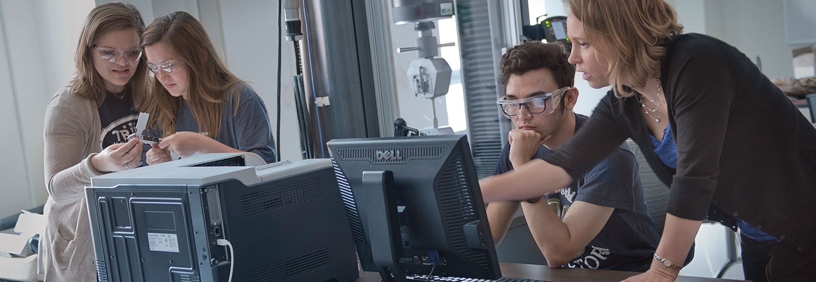 Professor with students in lab