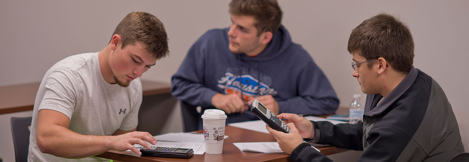 Three students in small group working