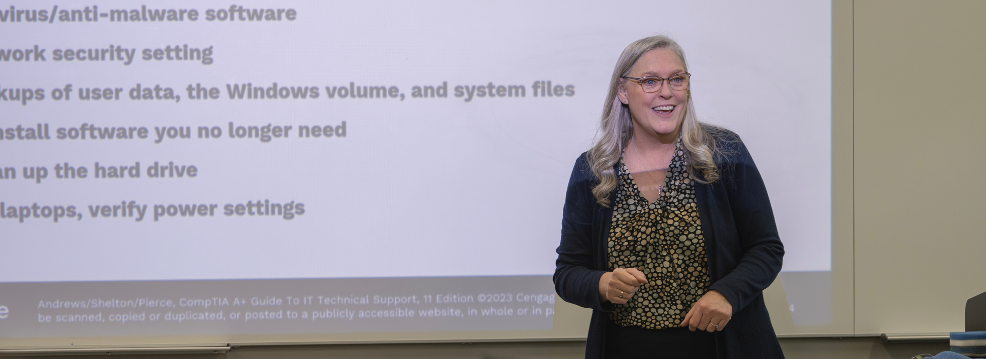 smiling professor teaching a class