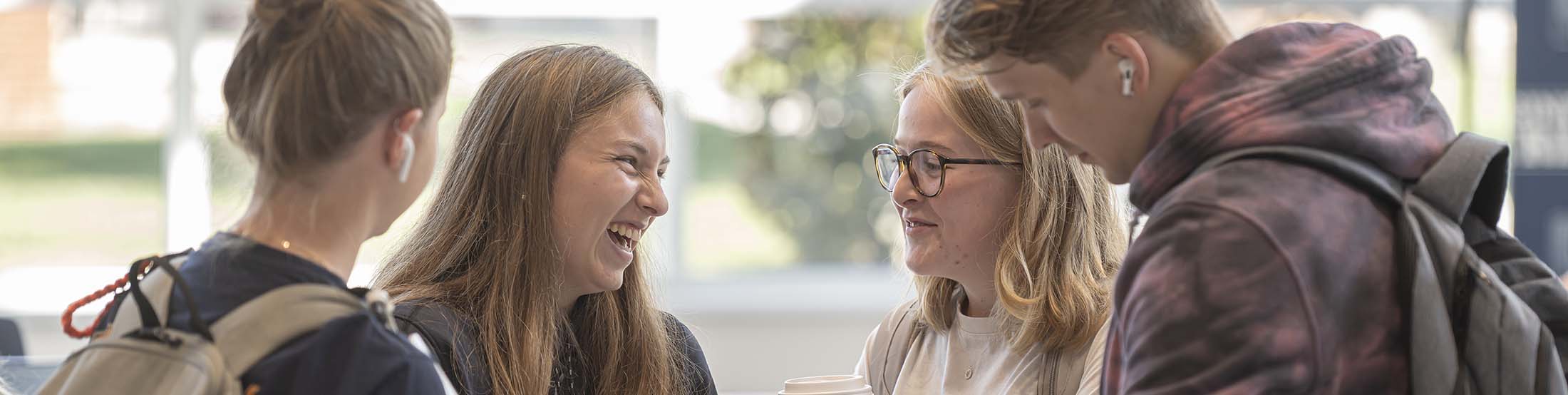 Students talking on patio