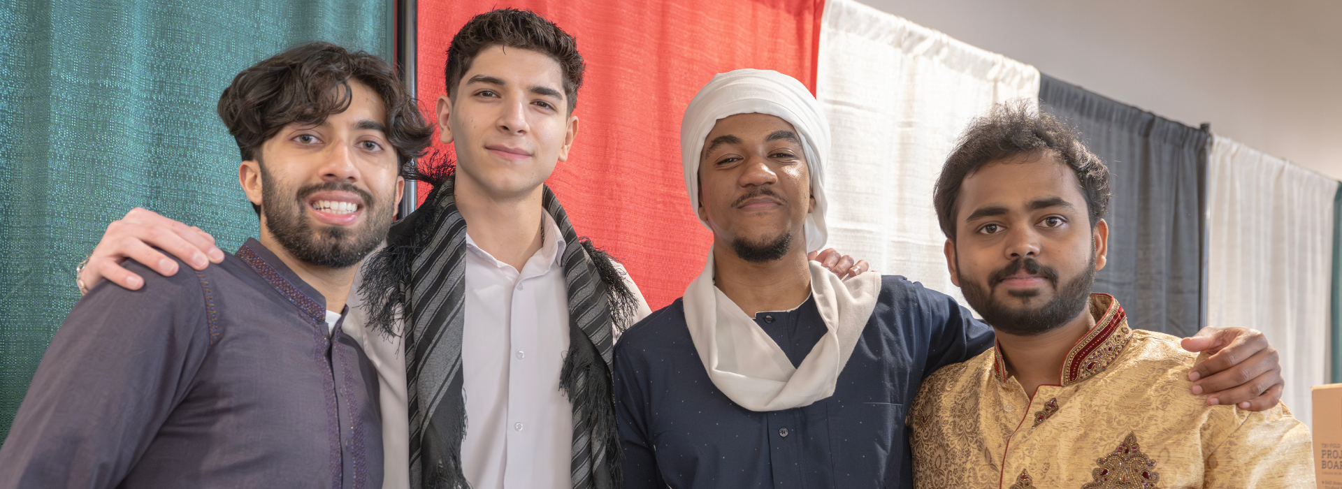 four students smiling
