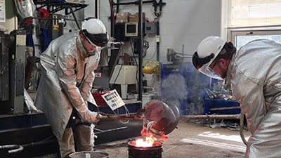 Students pouring in Foundry Lab