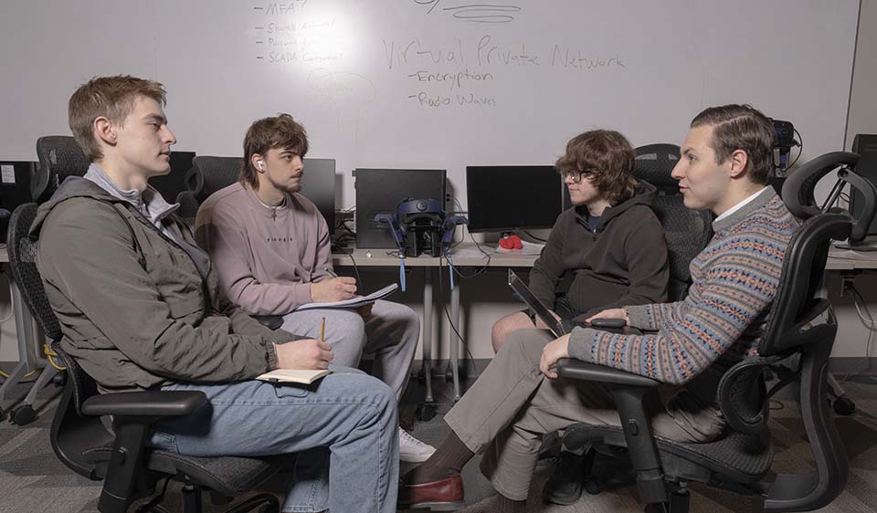 Computer science students discussing water safety