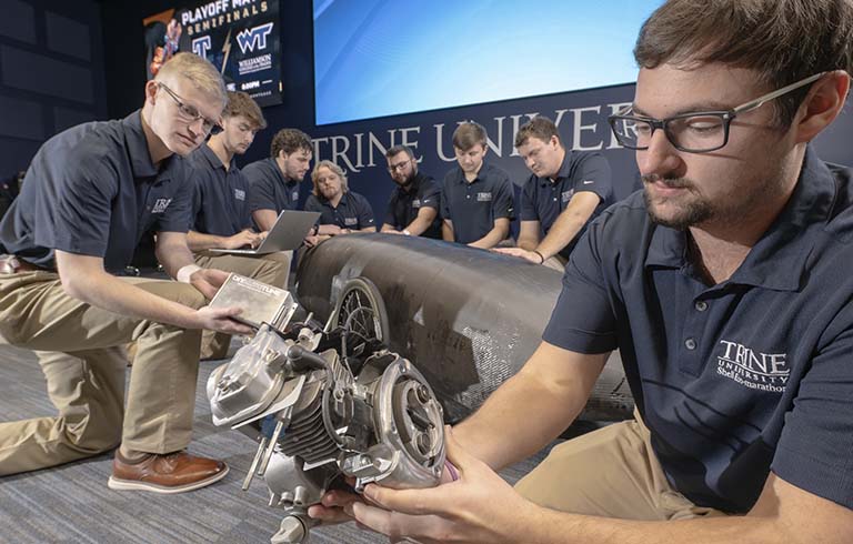 Trine University Eco-marathon team with car