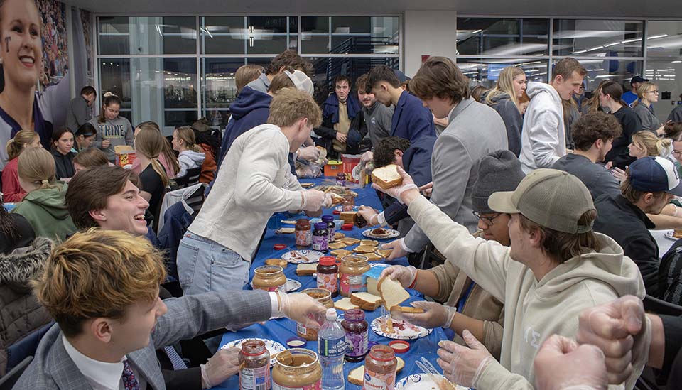 Students making PBJ sandwiches