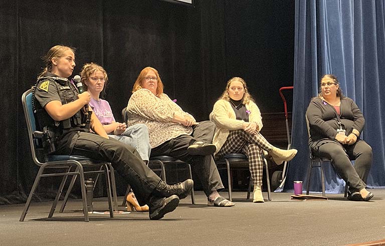 Five leaders in combating domestic violence on stage at Fabiani Theatre