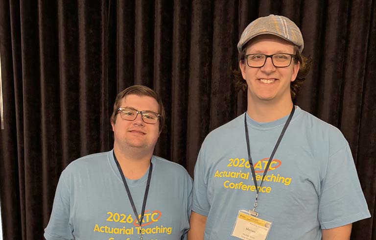 Steven Donovan and Michael Smith in conference T-shirts