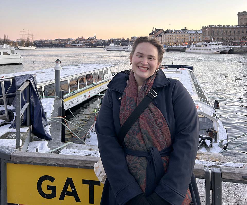 Grace Larson on the waterfront overlooking Gamla Stan, the old town in Stockholm, Sweden, outside of the Kungliga Operan (Royal Swedish Opera).