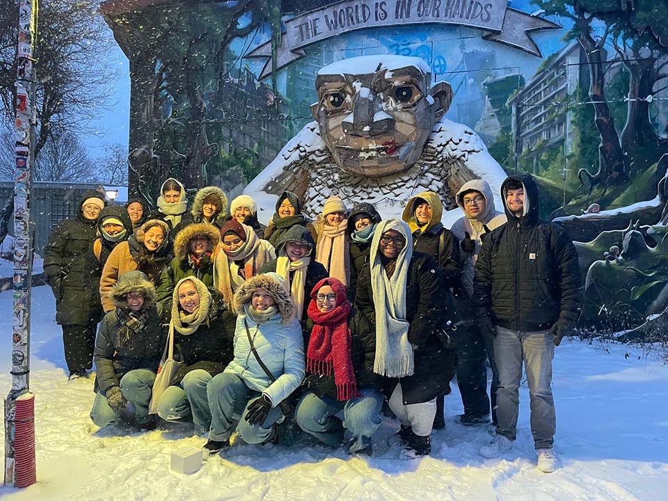 Students in front of sculpture in Christiania.