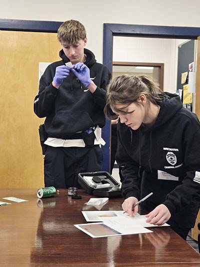 Students role-playing as crime scene technicians