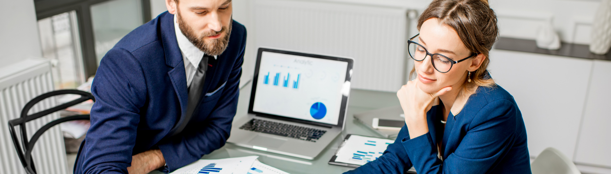 Man and woman looking at analytics chart